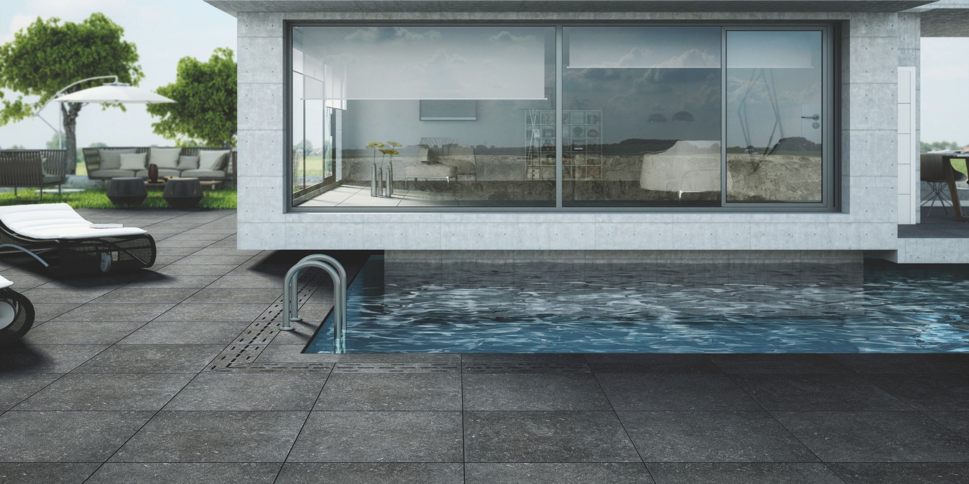 outdoor pool and lounging area with dark grey matt stone effect anti-slip porcelain outdoor floor tiles