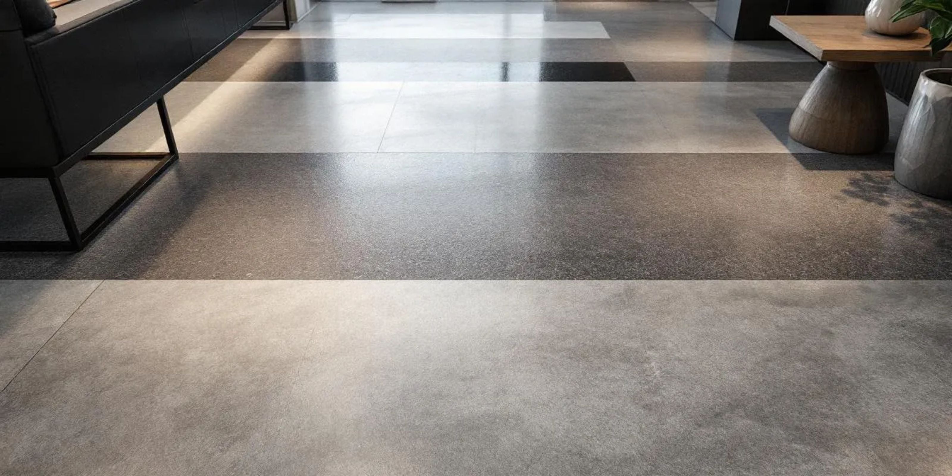 close-up of light grey and dark grey stone effect porcelain floor tiles