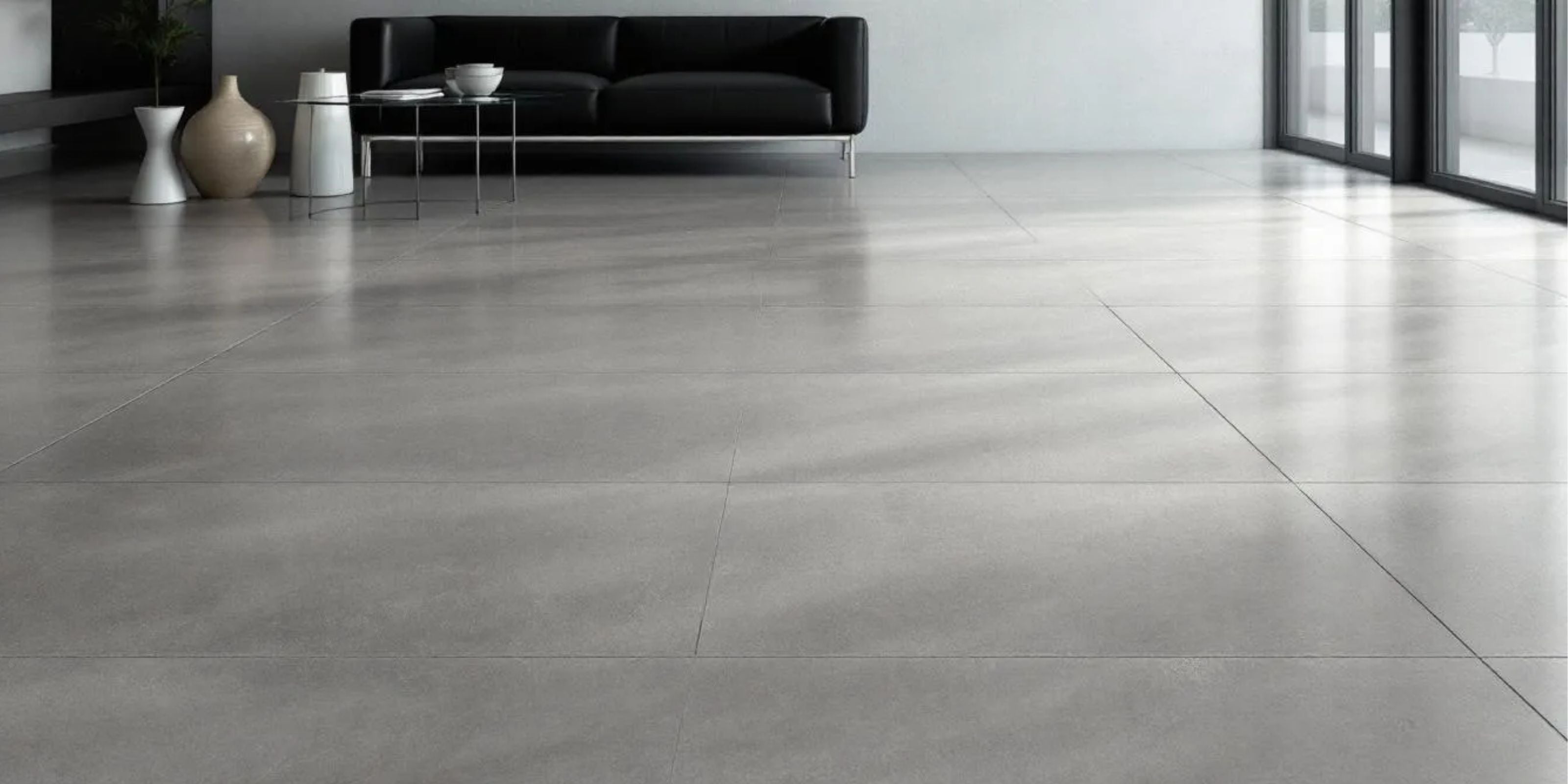living room with sliding glass doors. matt grey stone effect porcelain floor tiles