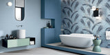 Large brand new bathroom with a freestanding bathtub and blue leaf patterned bathroom wall tiles