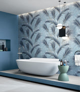 Brand new bathroom with freestanding bathtub and blue leaf patterned bathroom wall tiles