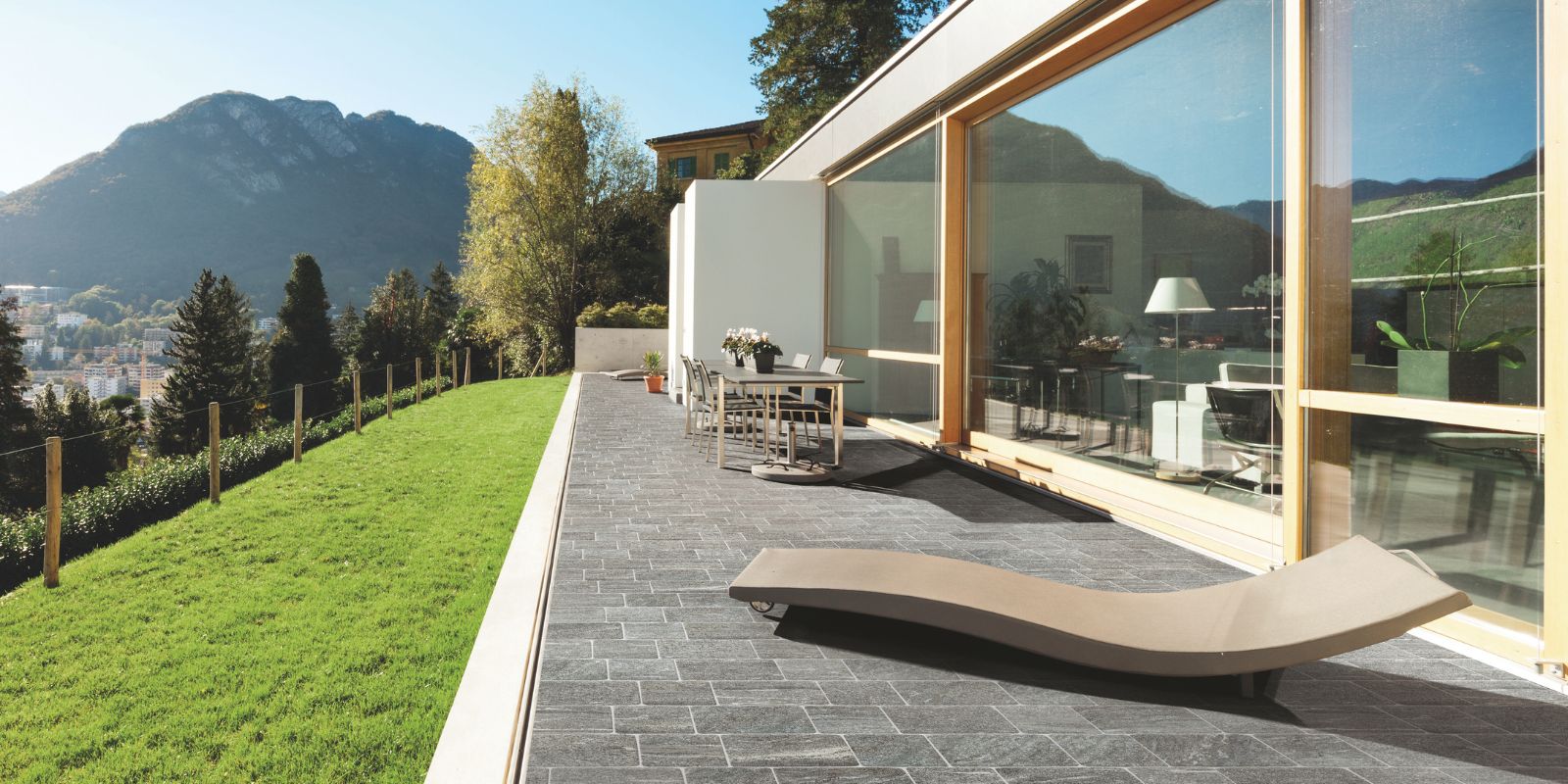 Outdoor patio with dining area and dark grey 20mm outdoor stone effect porcelain floor tiles