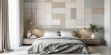 A beautifully designed feature wall in a bedroom using various wall tiles, enhancing the overall aesthetics.
