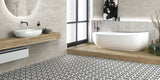 bathroom with intricate black and white victorian patterned bathroom floor tiles