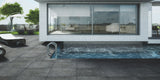 outdoor pool and lounging area with dark grey matt stone effect anti-slip porcelain outdoor floor tiles