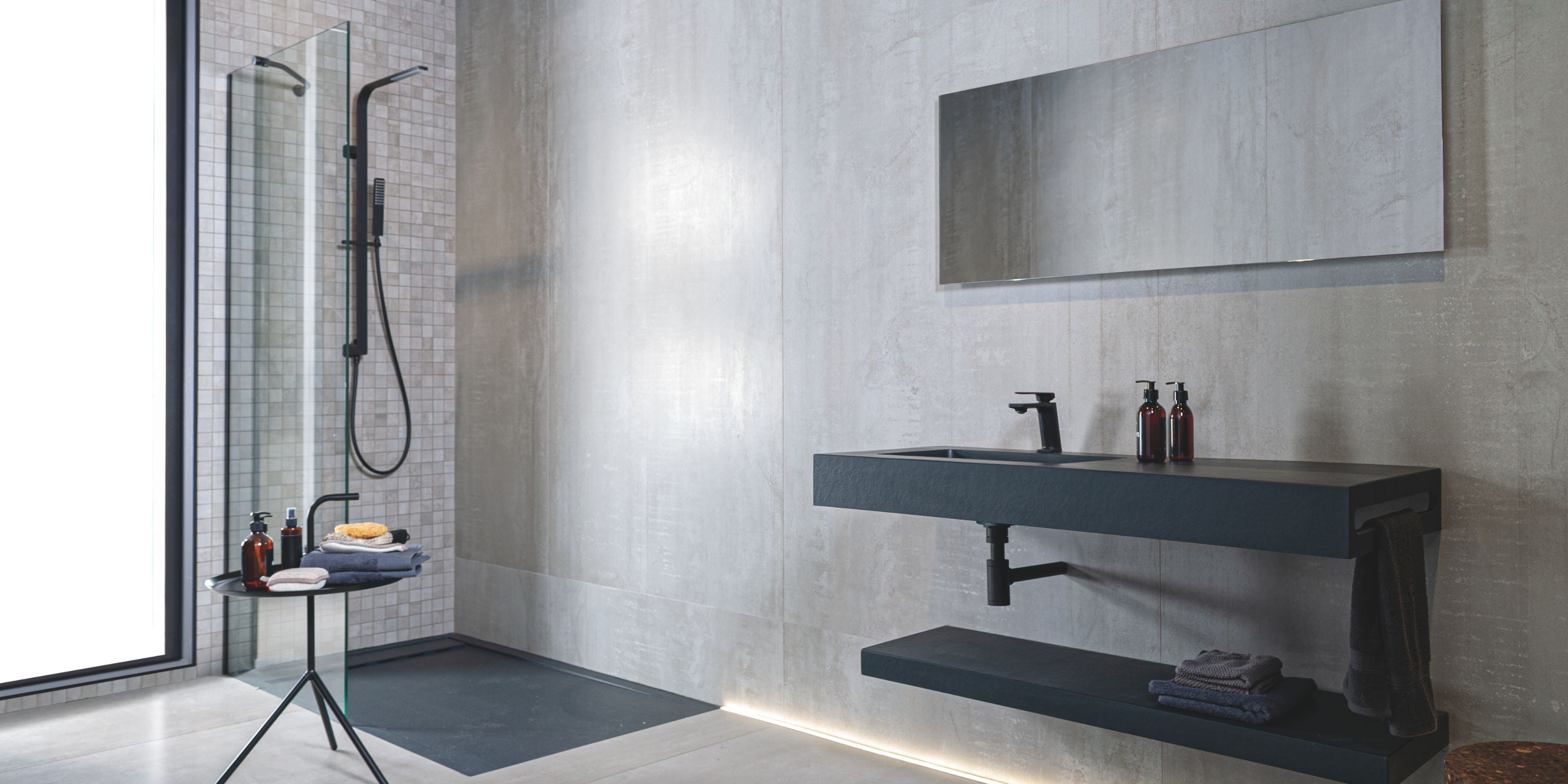 sleek modern bathroom with grey stone effect porcelain bathroom floor and wall tiles