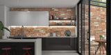 kitchen wth and orange brick effect stone cladding splashback 