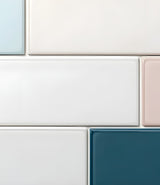 close-up of an arrangement of subway tiles in white blue pink and grey