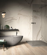 luxury modern bathroom with light brown wood effect porcelain floor tiles and white large-format marble effect wall tiles