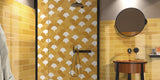 colourful bathroom with walk in shower, yellow subway wall tile and yellow fan shaped wall tiles